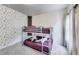 bedroom with a bunk bed, stylish wallpaper, plush carpet and plenty of natural light at 89 Little Magnolia Ln, Auburn, GA 30011