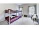 room with bunk beds, plush carpeting, natural light, and a cozy sitting area at 89 Little Magnolia Ln, Auburn, GA 30011