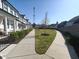 Picturesque community path featuring well-manicured landscaping, sidewalks, and charming homes, fostering neighborhood connection at 89 Little Magnolia Ln, Auburn, GA 30011
