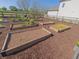Several raised garden beds on a mulch bed in this community garden space at 89 Little Magnolia Ln, Auburn, GA 30011
