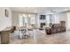 Bright and airy living room featuring hardwood floors, a fireplace, and comfortable seating at 89 Little Magnolia Ln, Auburn, GA 30011