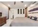 Spacious main bedroom with accent wall, recessed lighting, ceiling fan, and ensuite access at 89 Little Magnolia Ln, Auburn, GA 30011