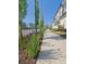 Clean sidewalk lined with greenery and purple flowers, offering a scenic walking path at 89 Little Magnolia Ln, Auburn, GA 30011