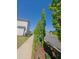 Neat street view featuring well-maintained sidewalks and lined with trees and shrubbery at 89 Little Magnolia Ln, Auburn, GA 30011