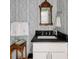 Charming bathroom with elegant floral wallpaper, white vanity, and an ornate mirror creates a warm, inviting ambiance at 2479 Peachtree Ne Rd # 1805, Atlanta, GA 30305