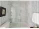Stylish bathroom with a marble tiled shower, glass door, and patterned wallpaper creates a relaxing space at 2479 Peachtree Ne Rd # 1805, Atlanta, GA 30305