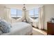 Bright bedroom with large windows, hardwood floors, chandelier, and custom curtains offer city views at 2479 Peachtree Ne Rd # 1805, Atlanta, GA 30305