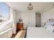 Sunlit bedroom with hardwood floors, city views, and stylish furnishings create a cozy and inviting space at 2479 Peachtree Ne Rd # 1805, Atlanta, GA 30305