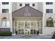 Building entrance with modern architecture, featuring glass doors and windows, and a well-maintained landscape at 2479 Peachtree Ne Rd # 1805, Atlanta, GA 30305