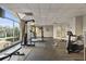 Well-lit gym with ample workout equipment, large windows, and rubber flooring at 2479 Peachtree Ne Rd # 1805, Atlanta, GA 30305