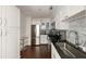Modern kitchen featuring stainless steel appliances, granite countertops, and white cabinetry at 2479 Peachtree Ne Rd # 1805, Atlanta, GA 30305