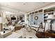Open-concept living space featuring hardwood floors, custom built-ins, and bright seating arrangements at 2479 Peachtree Ne Rd # 1805, Atlanta, GA 30305