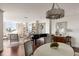 Open living space showcasing hardwood flooring, city views, and stylish piano at 2479 Peachtree Ne Rd # 1805, Atlanta, GA 30305