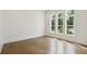 Bedroom with lots of light from large windows and hardwood flooring at 3975 Clifton Hill Court #7, Cumming, GA 30040