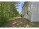 Large backyard with trees, patio, and grill at 415 Clairidge Sw Ln, Lawrenceville, GA 30046