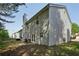 Large backyard with a concrete patio and space for outdoor dining and entertaining off the back of the home at 415 Clairidge Sw Ln, Lawrenceville, GA 30046