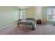 Cozy bedroom featuring carpet, natural light, and bedside tables at 415 Clairidge Sw Ln, Lawrenceville, GA 30046