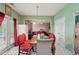 Cozy dining area adjacent to kitchen with stylish chairs and view into the comfortable living room at 415 Clairidge Sw Ln, Lawrenceville, GA 30046