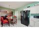 Inviting dining area, adjacent to the kitchen, complete with modern appliances and sleek countertops at 415 Clairidge Sw Ln, Lawrenceville, GA 30046