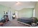Spacious bedroom with green walls, neutral carpet, and plenty of room at 415 Clairidge Sw Ln, Lawrenceville, GA 30046
