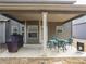 Covered back patio is great for outdoor entertaining with a seating area and grill at 180 Cleburne, Acworth, GA 30101