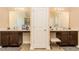 Spacious bathroom features double sinks, dark wood cabinets, tile floors, and a vanity seat at 180 Cleburne, Acworth, GA 30101