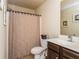 Cozy bathroom featuring a shower with curtain, vanity, and toilet at 180 Cleburne, Acworth, GA 30101