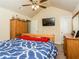 Bright bedroom boasts a ceiling fan, dresser, TV, and a large closet for ample storage at 180 Cleburne, Acworth, GA 30101