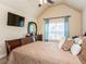 Comfortable bedroom features a large window with curtains and a TV at 180 Cleburne, Acworth, GA 30101