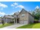 Beautiful home with well-maintained lawn, a two-car garage, and classic brick and siding exterior at 180 Cleburne, Acworth, GA 30101
