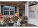 Inviting front porch with seating, decor, and a wreath on the door, highlighting curb appeal at 180 Cleburne, Acworth, GA 30101