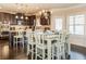 Bright eat-in kitchen with stainless steel appliances, a central island, and a dining table for casual meals at 180 Cleburne, Acworth, GA 30101