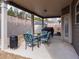 Covered patio with seating, grill and black smoker overlooking backyard at 180 Cleburne, Acworth, GA 30101