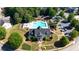 Aerial view of a neighborhood pool, clubhouse, playground, and well-maintained landscaping at 308 Jessica Way, Canton, GA 30114