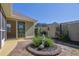 Beautifully landscaped backyard with stone patio and statue feature, providing a serene and private outdoor space at 308 Jessica Way, Canton, GA 30114