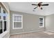 Carpeted bedroom with two windows letting in natural light at 308 Jessica Way, Canton, GA 30114