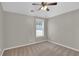 Bright bedroom featuring neutral walls, a ceiling fan, and plush carpeting for a comfortable living space at 308 Jessica Way, Canton, GA 30114