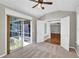 Cozy bedroom with carpet, ceiling fan, and access to the backyard at 308 Jessica Way, Canton, GA 30114