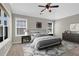 Bright bedroom with neutral colors, large windows, ceiling fan, and stylish décor at 308 Jessica Way, Canton, GA 30114