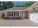 Inviting home exterior boasting manicured landscaping and a covered front entry at 308 Jessica Way, Canton, GA 30114