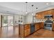 Well-equipped kitchen features an island, stainless steel appliances, and a dining area nearby at 308 Jessica Way, Canton, GA 30114