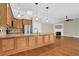 Open-concept kitchen features an island, stainless steel appliances, and transitions into the living space at 308 Jessica Way, Canton, GA 30114