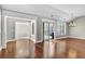 Elegant living room featuring hardwood floors, crown molding, and natural light from the sliding door at 308 Jessica Way, Canton, GA 30114