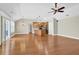 Open-concept living space with hardwood floors seamlessly connects the living room to the kitchen at 308 Jessica Way, Canton, GA 30114