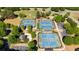 Aerial view of tennis courts surrounded by lush green trees in a well-maintained community at 308 Jessica Way, Canton, GA 30114