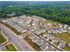 An aerial view showcases a community with lush landscaping, a pool, and well-maintained roads at 3638 Silvery Way, Powder Springs, GA 30127