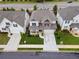Aerial view of a two-story home with a well-manicured lawn and a two-car garage at 3638 Silvery Way, Powder Springs, GA 30127