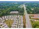 Aerial image of a residential community near a highway, surrounded by a green, wooded area at 3638 Silvery Way, Powder Springs, GA 30127