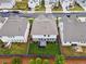 Aerial view of a fenced backyard with a patio and well-manicured lawn in a residential neighborhood at 3638 Silvery Way, Powder Springs, GA 30127