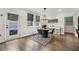 Cozy dining area with stylish lighting, a modern table, and access to the backyard at 3638 Silvery Way, Powder Springs, GA 30127